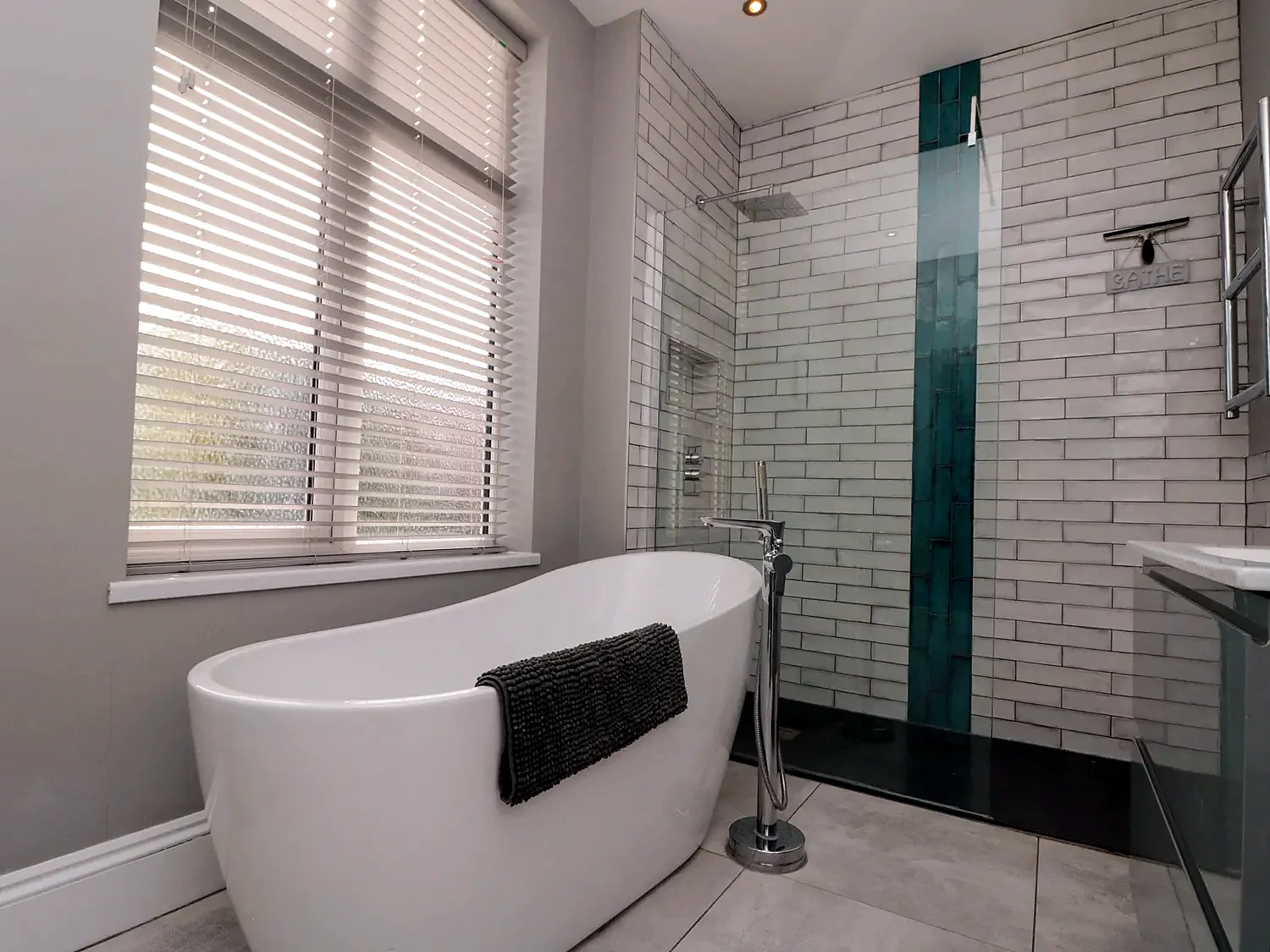 Bathroom with freestanding bath and separate shower